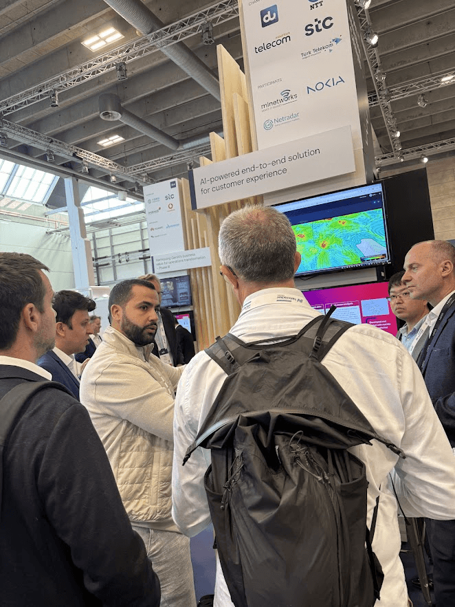 The MLNetworks team presenting to visitors at DTW Ignite 2025