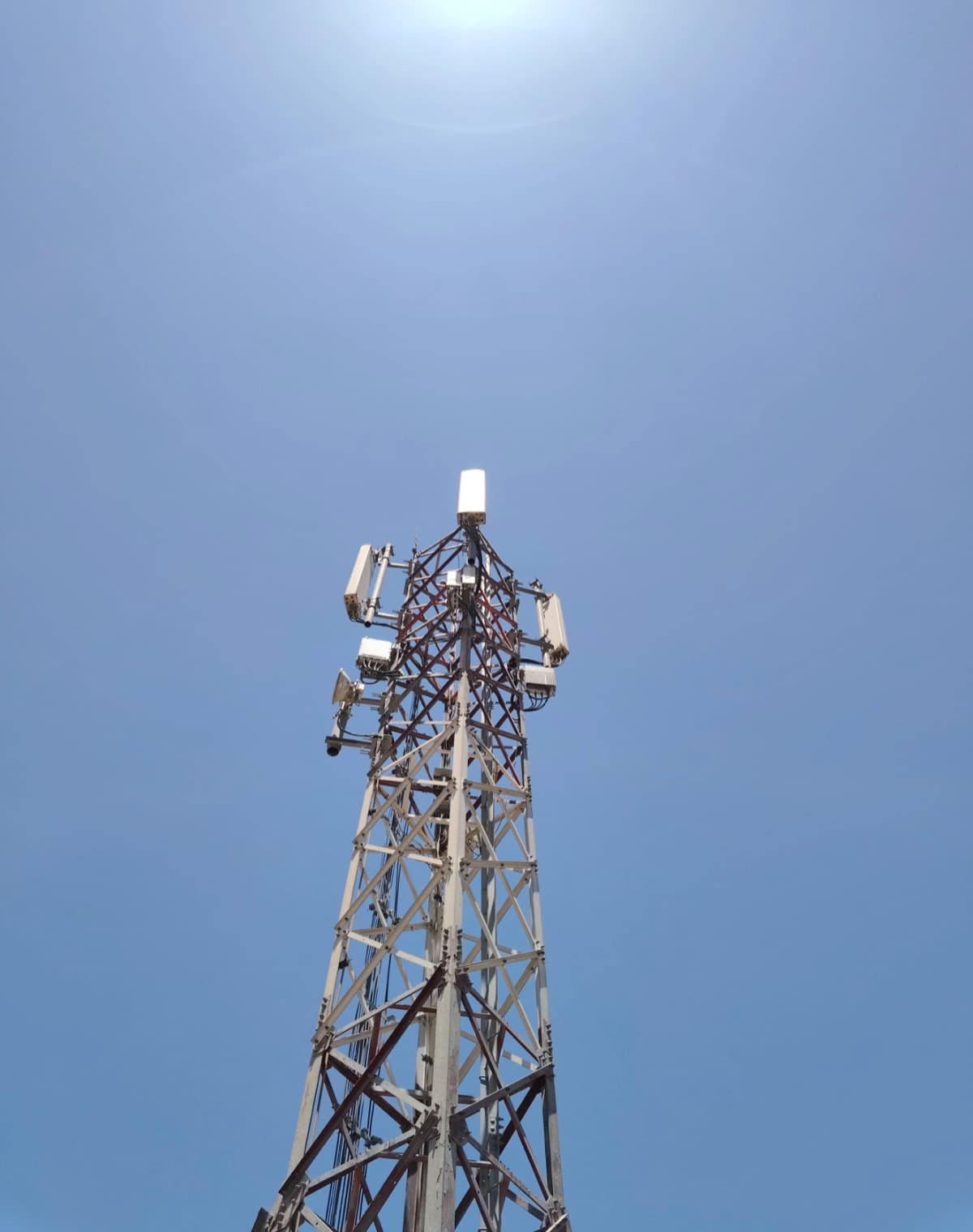 A lattice telecom tower seen from below